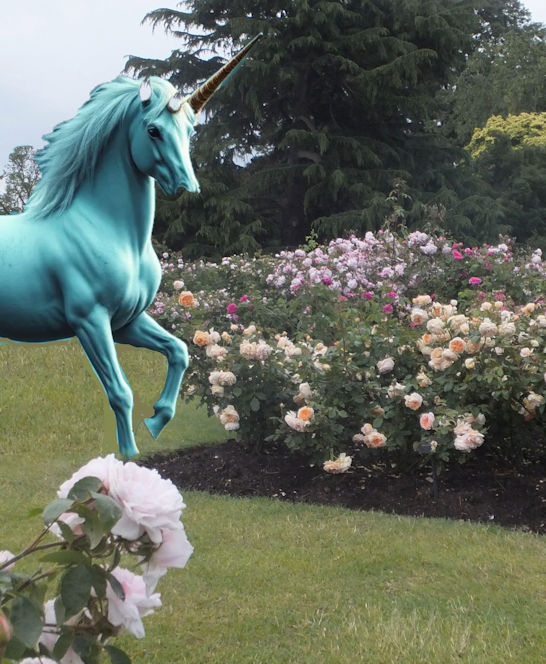 A unicorn standing in a rose garden