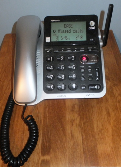 A telephone sitting on a table